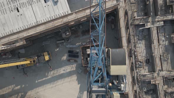 Tower Crane Structure. Drone View Of Counterweights, Mast, Cabin, And Boom Of An Industrial Tower Cr alt