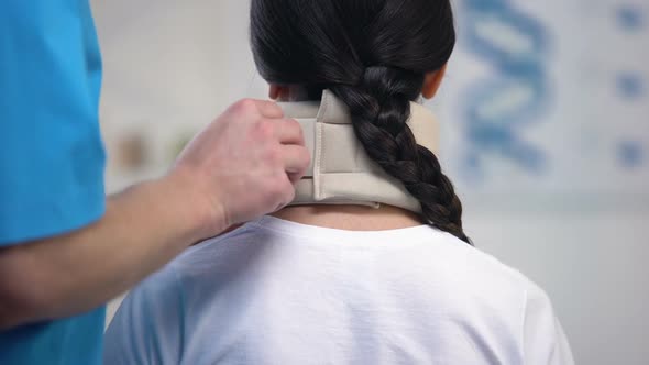 Orthopedist Fixing Female Patient Foam Cervical Collar Rehabilitation Period alt