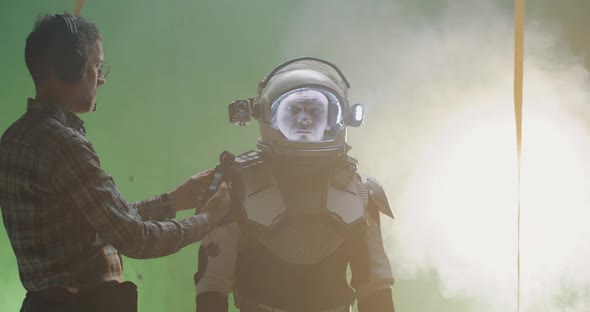 Technician Using His Light Meter on a Film Set alt