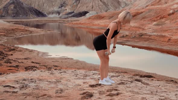 Woman working out on lifeless dried locality