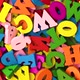 Multi-colored letters are scattered in a chaotic manner moving in a circular rotation. - VideoHive Item for Sale