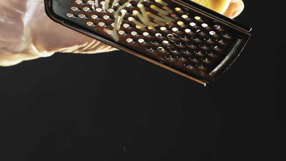 Chef in Gloves Grates Delicious Cheese for Traditional Pasta alt