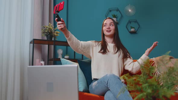 Girl Blogger Influencer Taking Selfie on Smartphone Make Virtual Social Media Video Online at Home alt