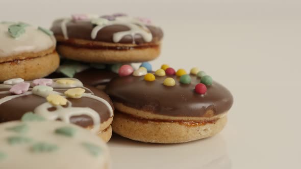 Glazed and stuffed cookies with sprinkles  close-up 4K 2160p 30fps UltraHD tilting footage - Tasty t alt