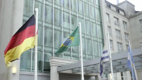 International flags wave in the breeze in front of a luxury hotel in Buenos Aires, Argentina alt