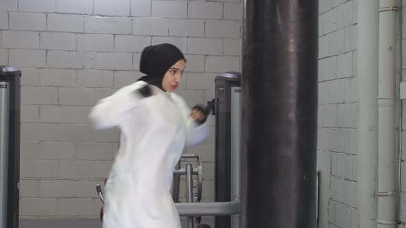 Confident Muslim Woman Stands in the Pose of a Fighter Boxing in the Gym Boxing in the Fitness