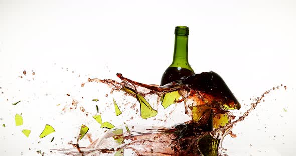 900136 Bottle of Red Wine Breaking and Splashing against White Background, Slow motion 4K alt