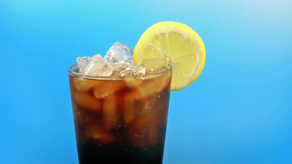 Passing Iced Coke Drink With Lemon alt