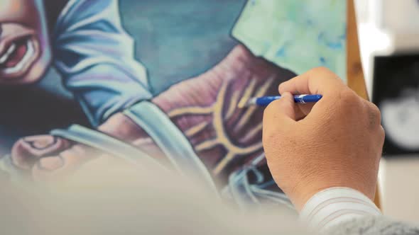 Artist painting Artwork depicting Taliban rule in Afghanistan. Close up Shot alt