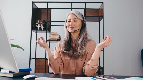 Peaceful Concentrated Mature Businesswoman Sit at Office Desk Meditating at Workplace Calm Focused alt