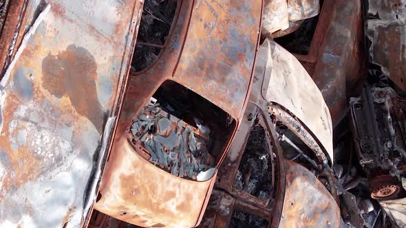 Vertical Video of Burnt Cars During the War in Ukraine alt