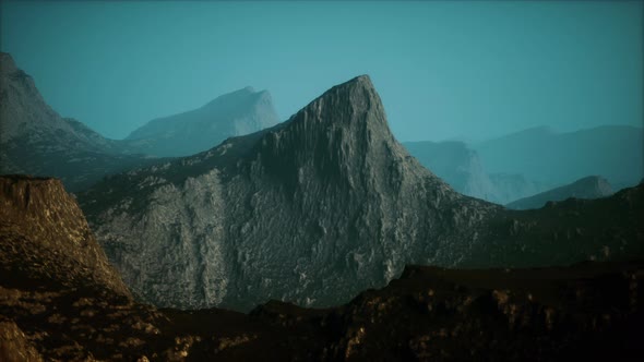 Landscape of the Dolomites Mountain Range Covered in the Fog alt