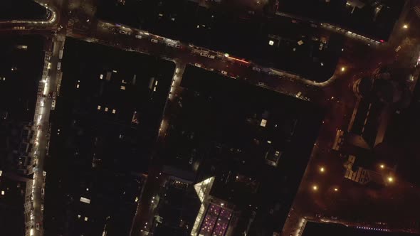 Top Down Panning Footage of Illuminated Streets Squares and Buildings in Night City alt