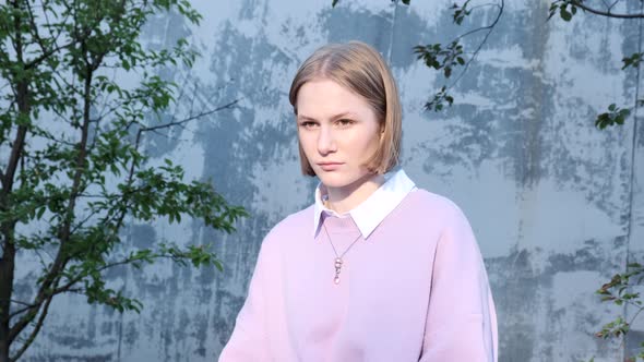 Portrait of Young Woman Student Near University Building alt