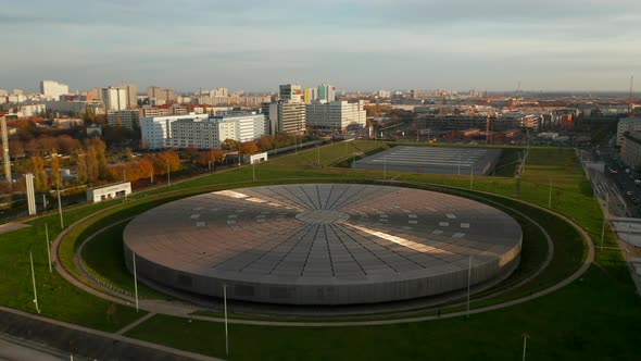 Establishing Shot Above Futuristic Velodrome Building Cycling Arena in Berlin, Germany, Aerial View alt
