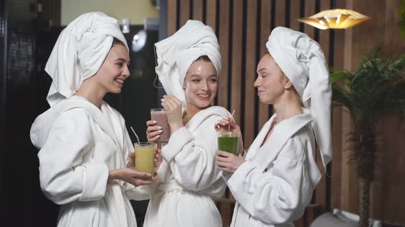 Cleansing the Body of Toxinsgirlfriends in Spa Salon Wearing Bathrobes