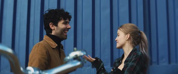 Young woman and man talking and having a conversation while laughing alt