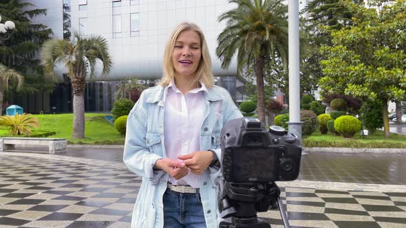 Blogger Filming Herself on Camera in the City