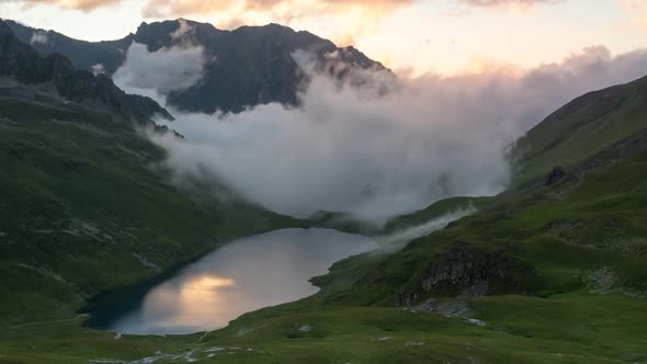 Evening view of mountain lake and stormy clouds