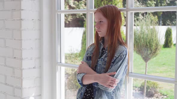 Lonely Sad Girl Standing By Window alt
