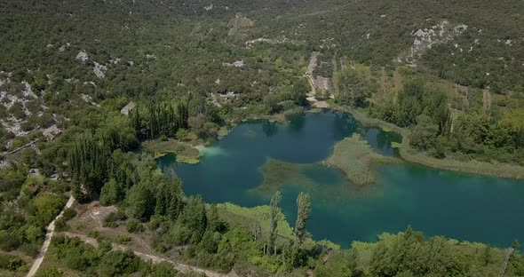 AERIAL: Green plantations and lake in Croatia alt