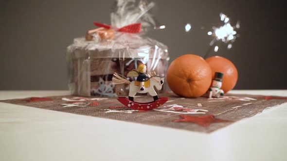 Another slow motion little see-saw horse with Christmas mood and lighting sparkler. alt