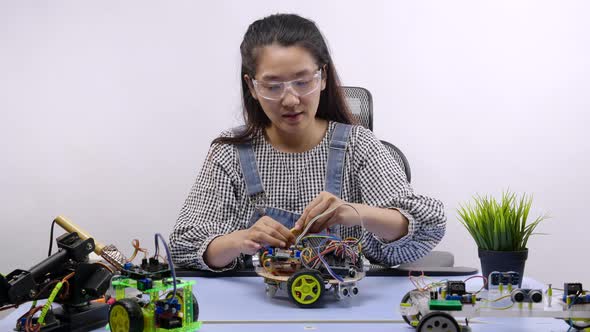 Robotics Engineer testing a robot. Innovative technology mechanical for Assistive Technology alt