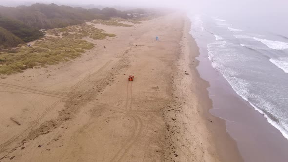 Aerial view of the beach shore seaside at Pajaro Dunes California with a backhoe alt