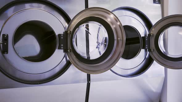 Row of Modern Washing Machine in Public Laundry
