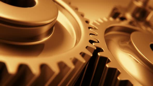 The motion of copper gears working together in endless rotation. Loopable. HD alt