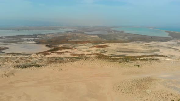 Aerial Vast Desert Sands Adjacent to the Small Lakes and Wetlands alt