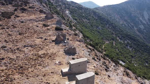 Mills in Motion on Mountain Peak By Mediterranean Sea Crete Greece alt