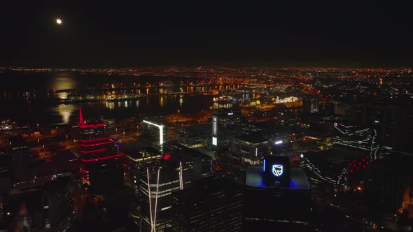 Illuminated Modern High Rise Downtown Buildings and Harbour on Coast alt