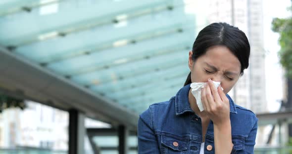 Woman Sneeze at Outdoor alt
