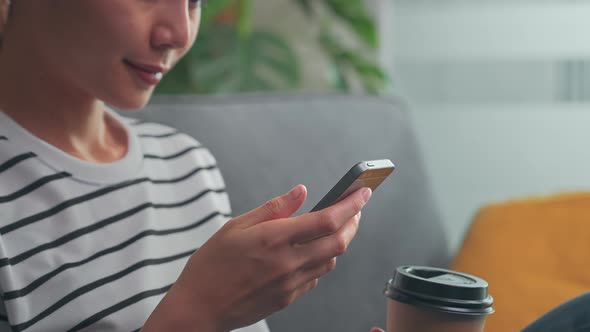 Woman using smartphone, During leisure time. alt
