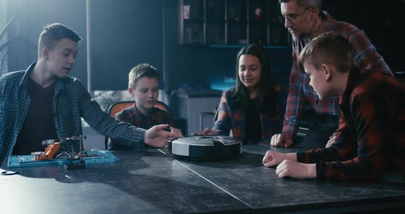 Teacher and Students Testing Robot alt