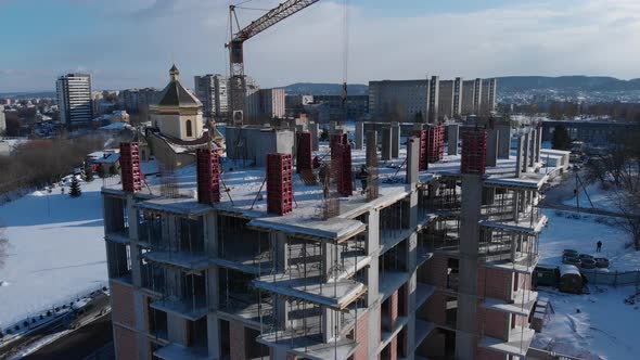 Aerial shot of building residental house on construction site. alt
