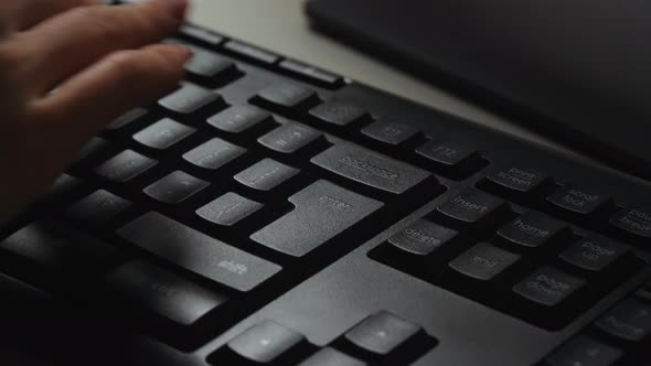 Woman using computer hitting the enter. alt