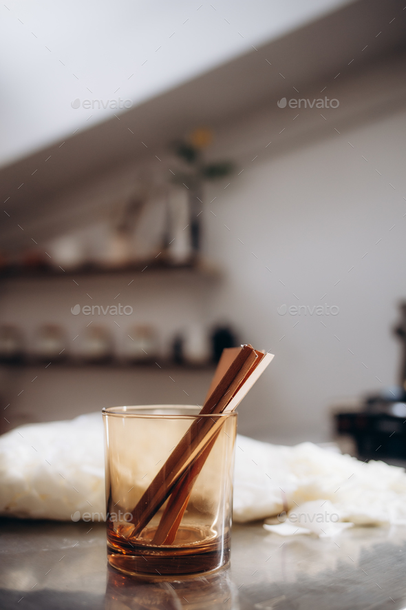 Wooden wick for candle making at the table. Making homemade candle.  Crackling wick. Stock Photo by fentonroma