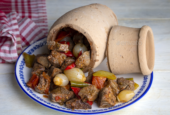Authentic Turkish Testi Kebab cooked in earthenware waterjug, Turkish name; Testi kebabi - Stock Photo - Images
