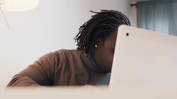 Emotional Black Man Showing Gift on Video Call alt