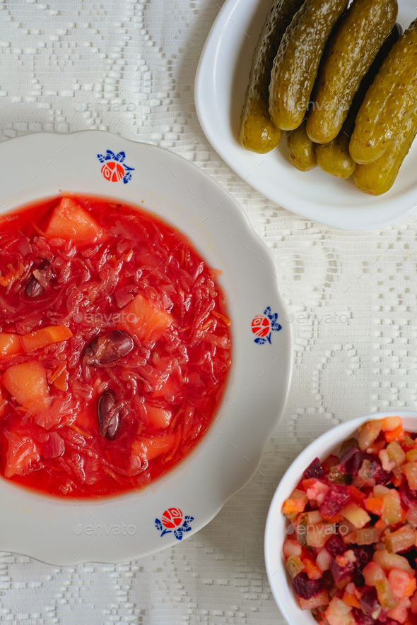 Ukrainian traditional dishes. Lean borscht, vinaigrette, pickled cucumbers