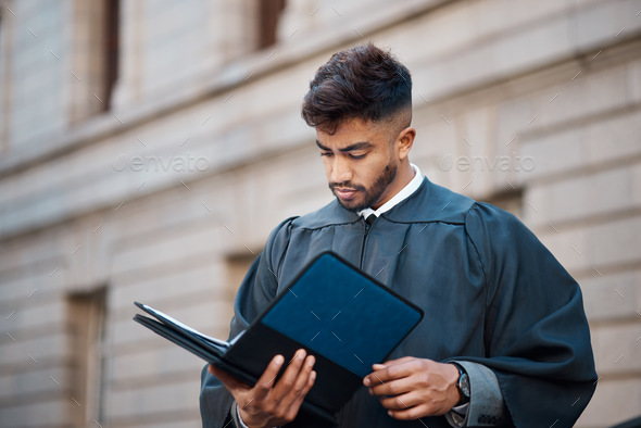 Legal, research and a lawyer man reading documents on a city street in preparation of a court case