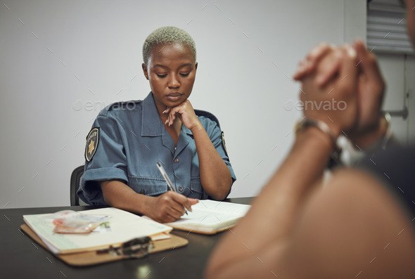 Security, criminal and female police officer at the station writing a legal report for social justi