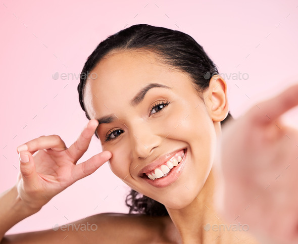 Selfie, peace hand sign and happy woman in studio with natural beauty, wellness and cosmetics. Port