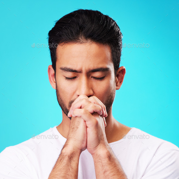Praying, hands and man in meditation or worship to God for faith or belief in spirituality, mindful