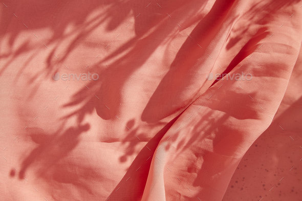 Floral cloth texture with sunny shadows. Springtime natural background.
