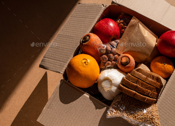 Healthy food delivery flat lay shadows. Take away products.Donation box New normal online shopping