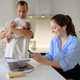 Family with baby in kitchen with gadgets - PhotoDune Item for Sale