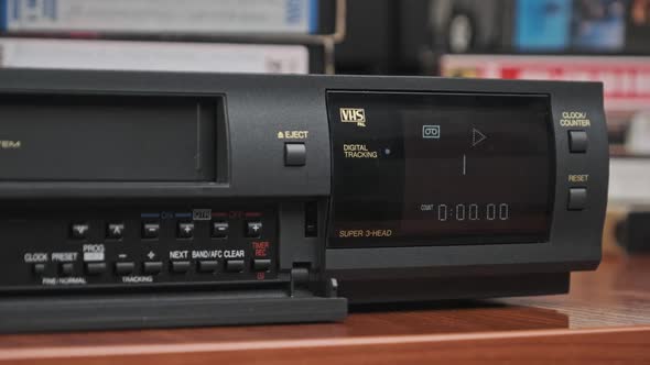 Insert VHS Cassette Into VCR and Push Play Button alt